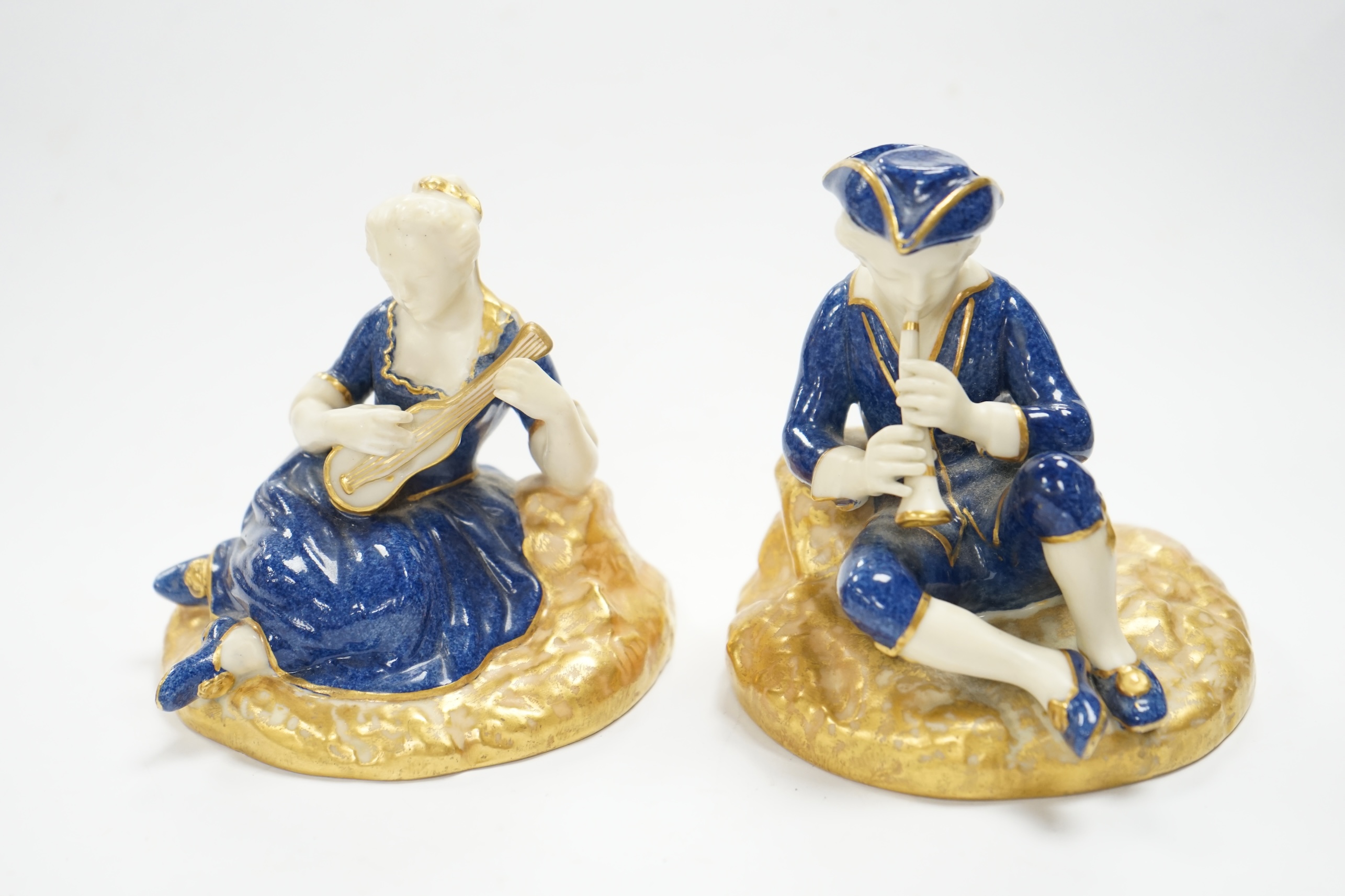 A pair of Worcester seated musicians, 1919, tallest 9.5cm. Condition - fair to good